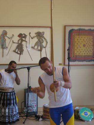Playing the berimbau